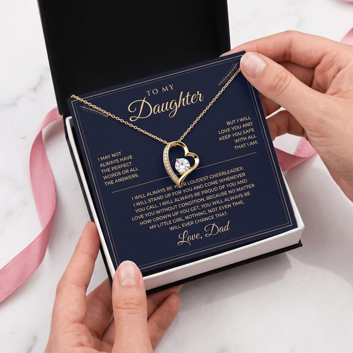Yellow gold necklace on the message card in its gift box
