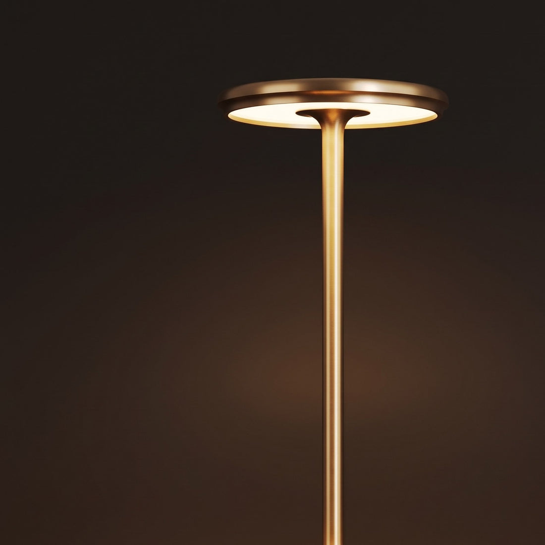Gold GLIMMA cordless table lamp, switched on