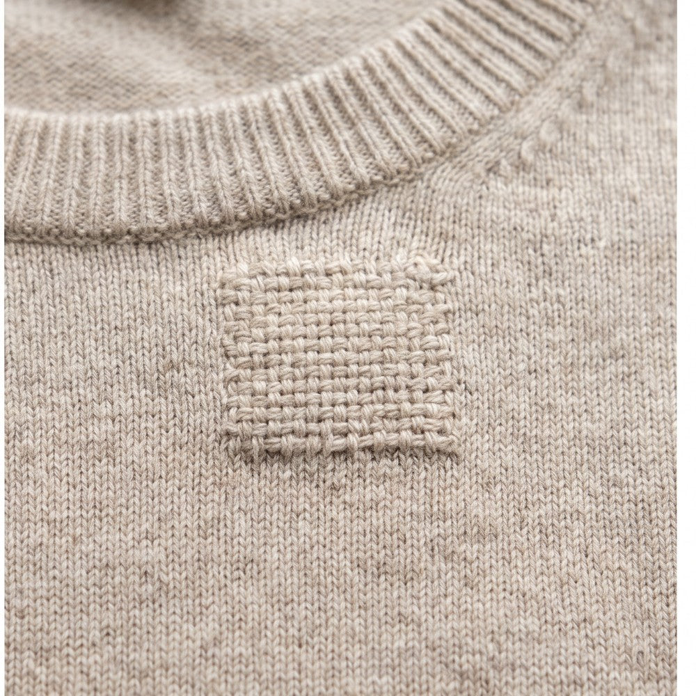 The same spot covered by a neat woven patch
