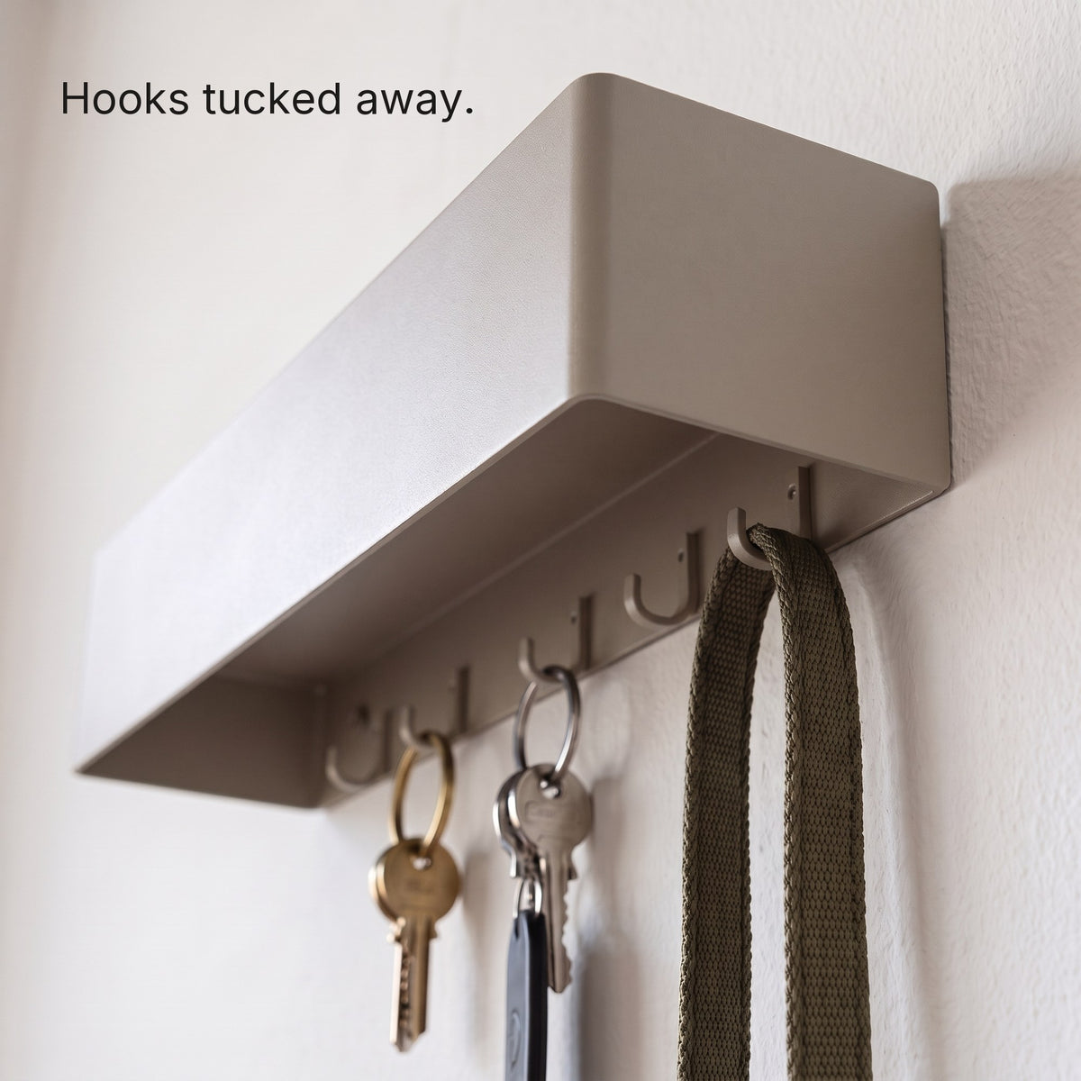 Six hidden hooks under the Key Shelf holding keys and a lead