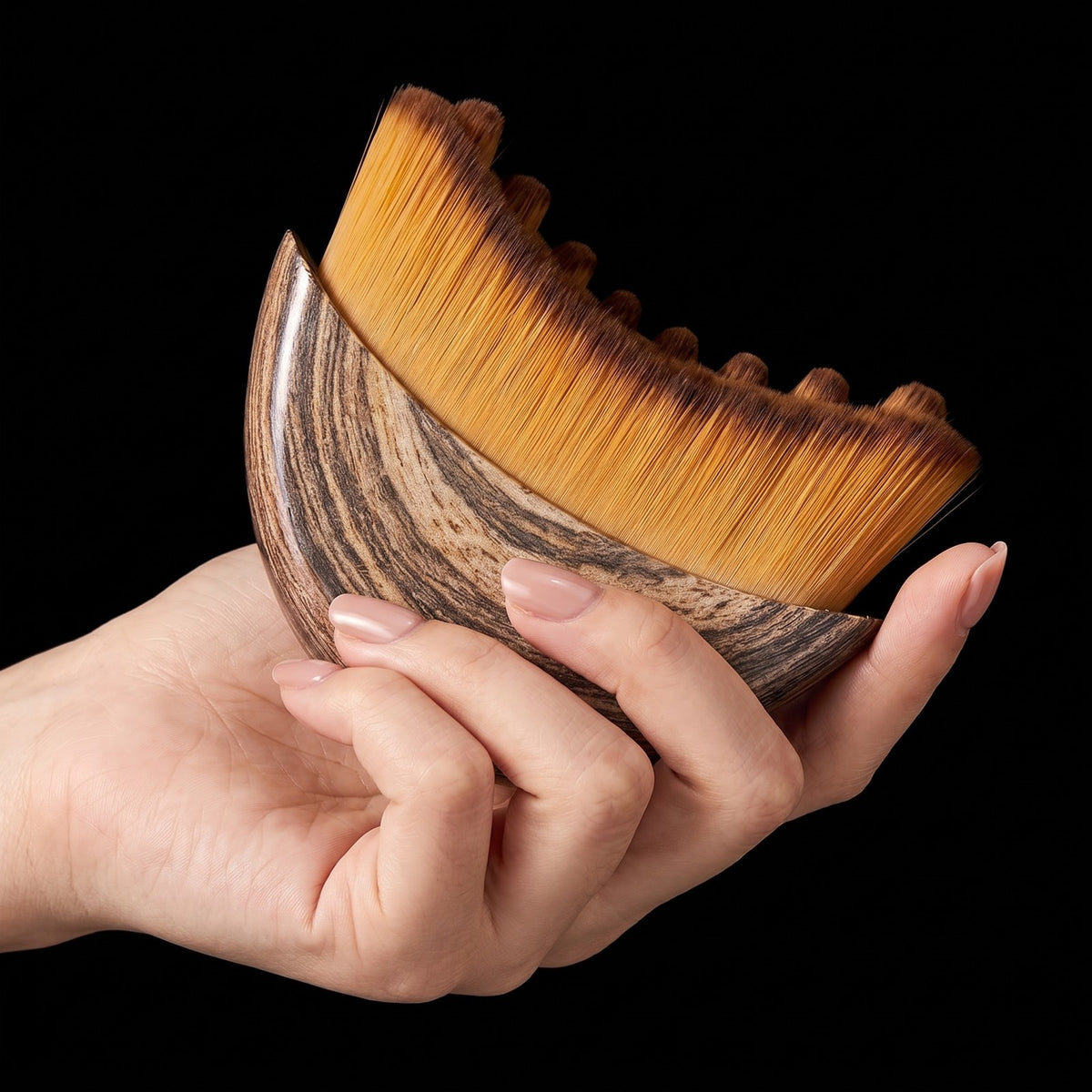 The LYFTA brush held in the hand