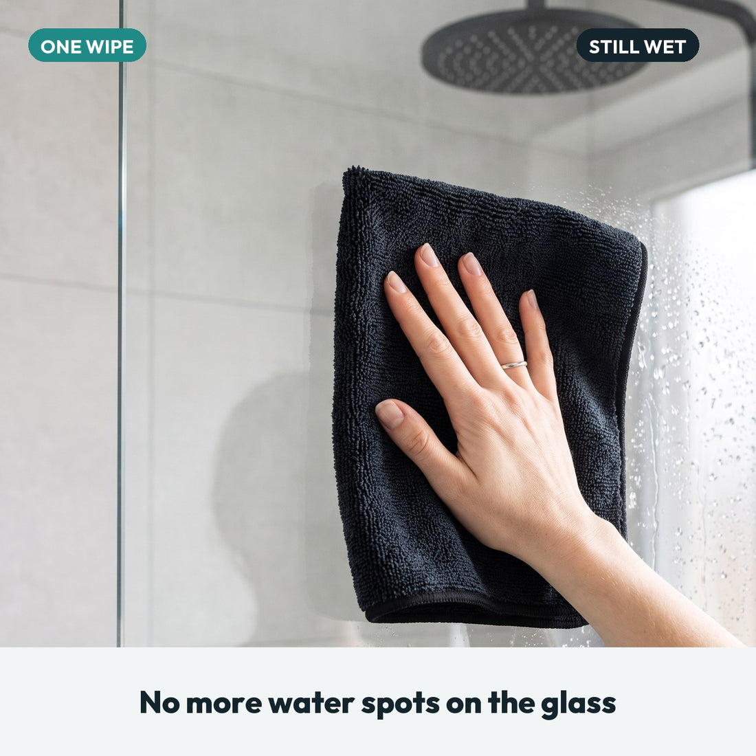 Drying a wet glass shower screen with the PUTSA cloth in one wipe