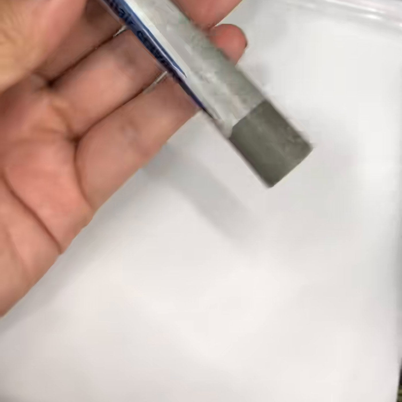 Grey REPA wax stick in hand