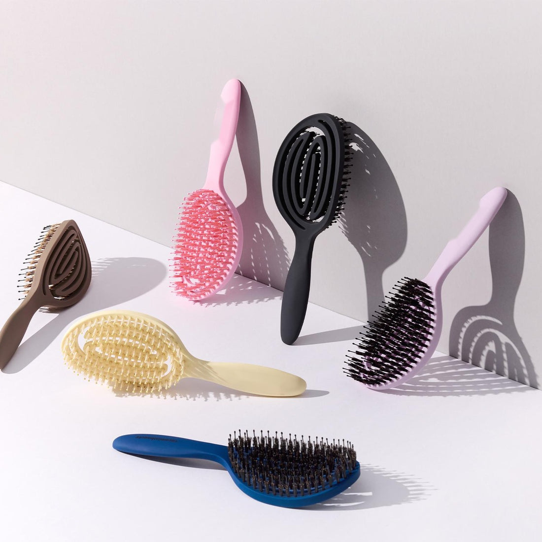 SKIMRA brushes in pink, charcoal, lilac, cream, taupe and navy
