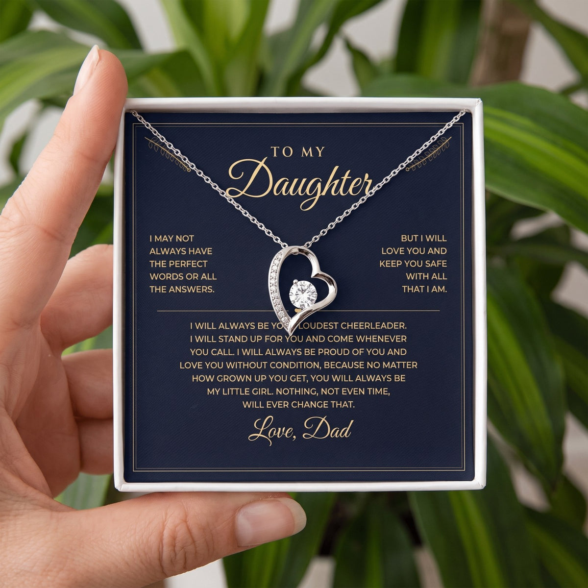 Holding the gift box with the message card and white gold necklace