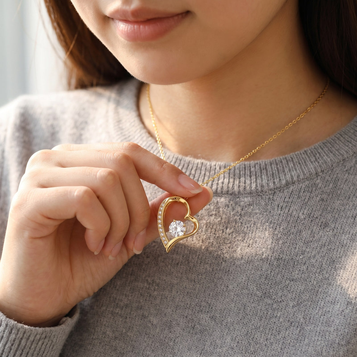 The yellow gold heart necklace worn
