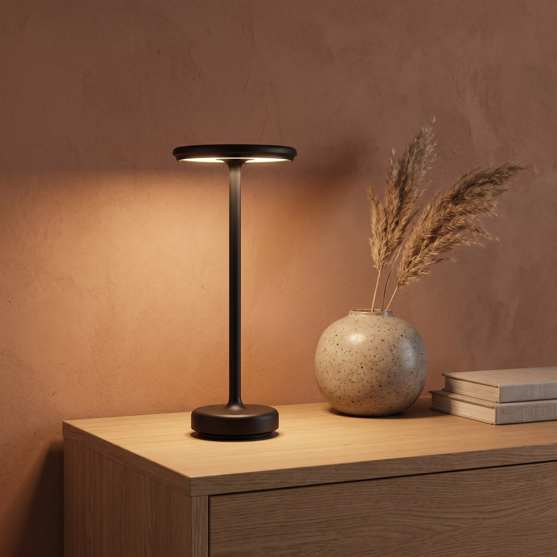 Black GLIMMA lamp on an oak sideboard