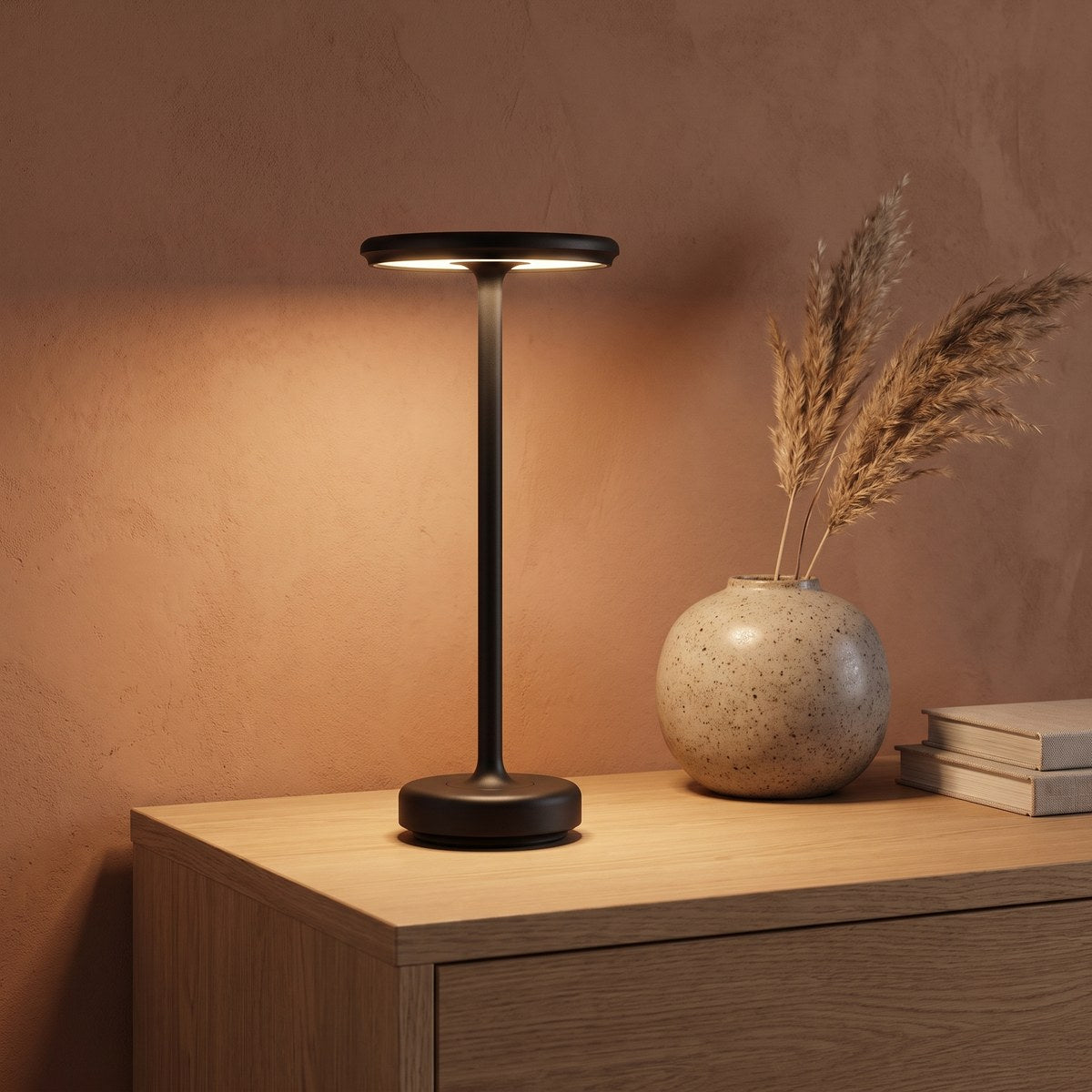 Black GLIMMA lamp on an oak sideboard