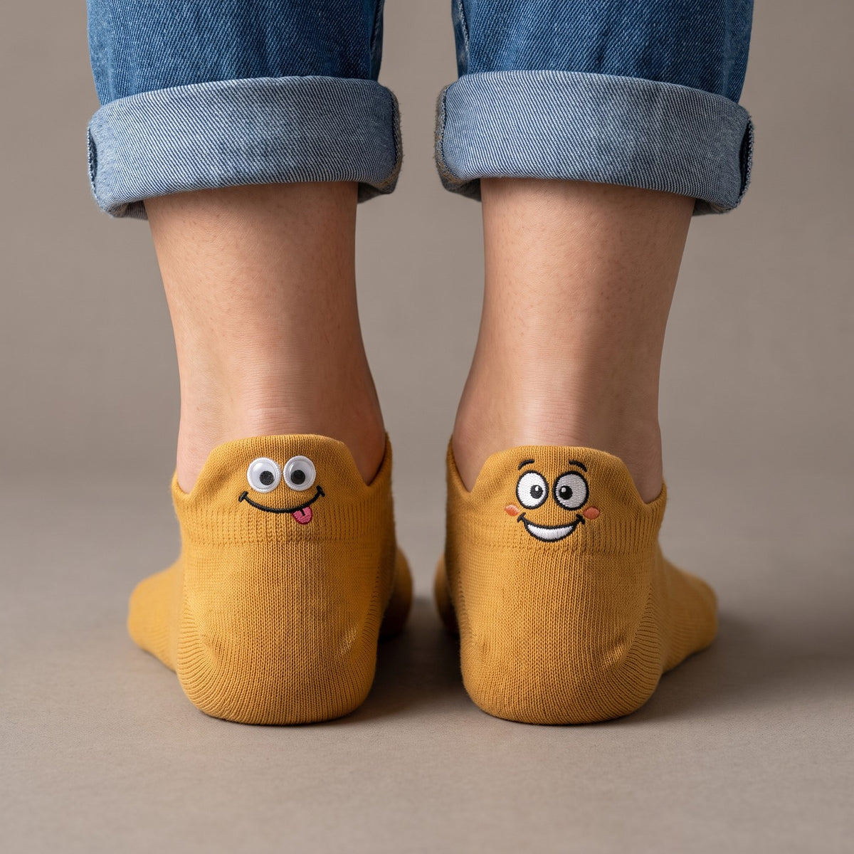 Mustard TASSA socks, two happy faces on the heel tabs