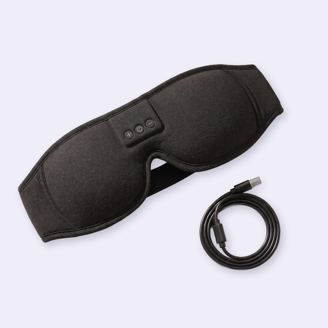 The black knit Hushband and its charging cable
