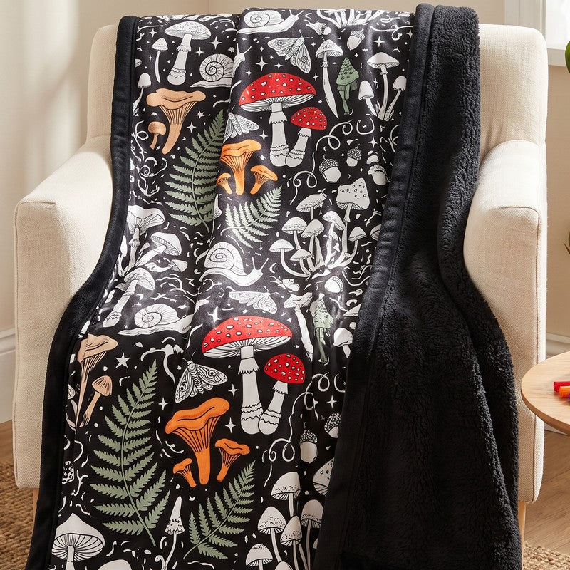 The Mushroom Magic blanket on an armchair