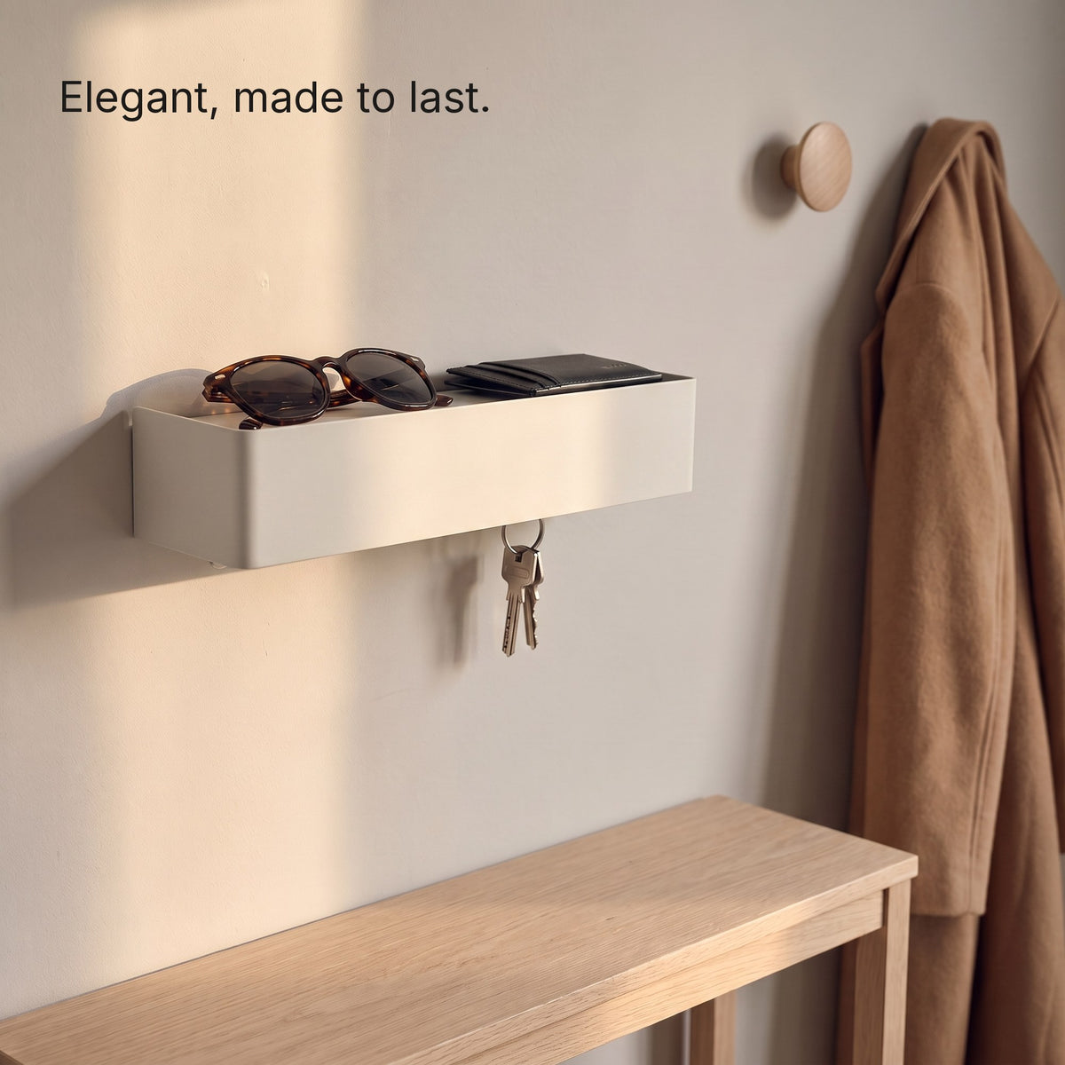 Key Shelf with sunglasses and a card holder above a console