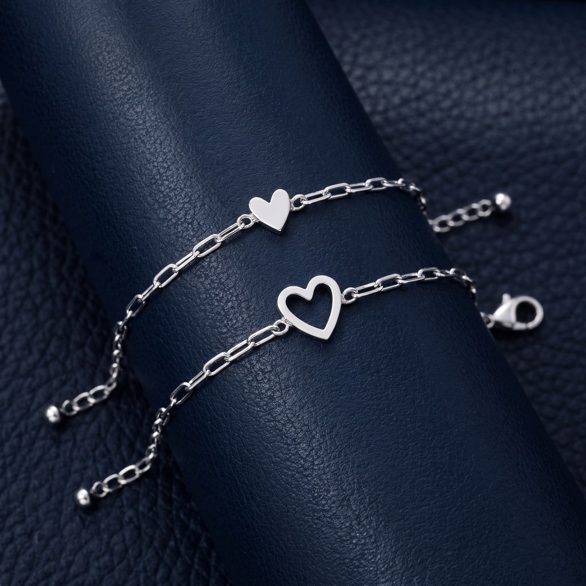 The NARA Bond set in silver: open heart and little solid heart bracelets