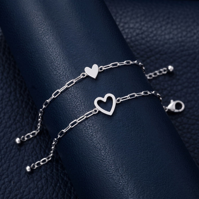 Silver — The NARA Bond set in silver: open heart and little solid heart bracelets