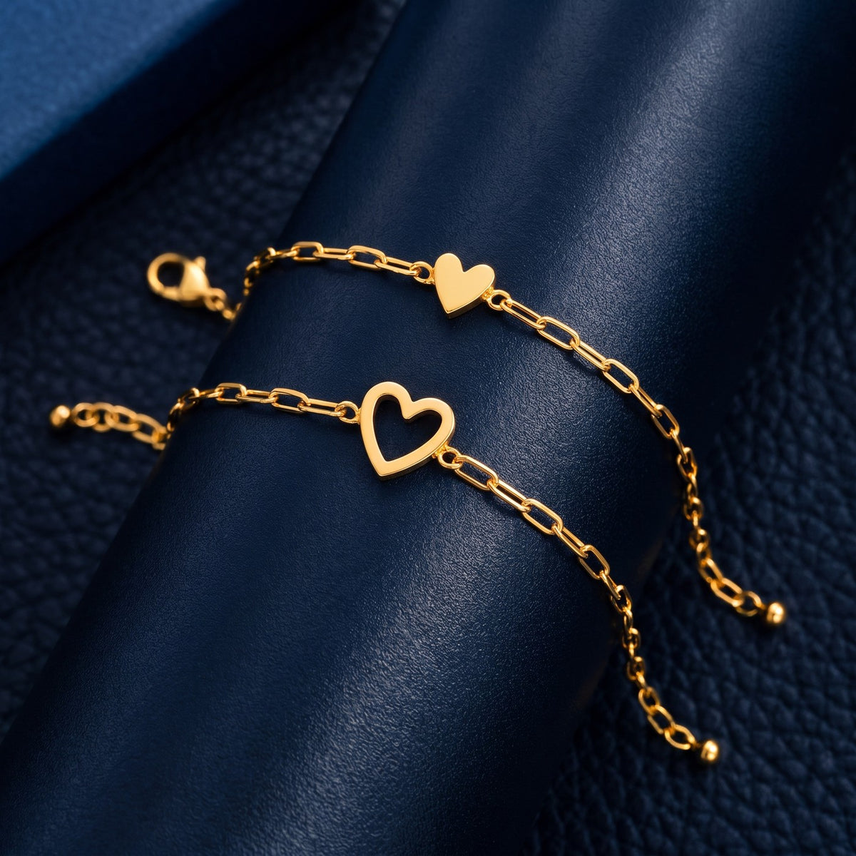 The NARA Bond set in gold: open heart and little solid heart bracelets