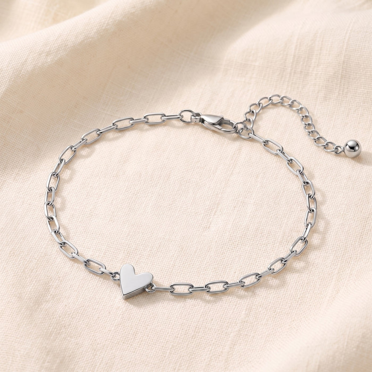 Silver bracelet with the little solid heart