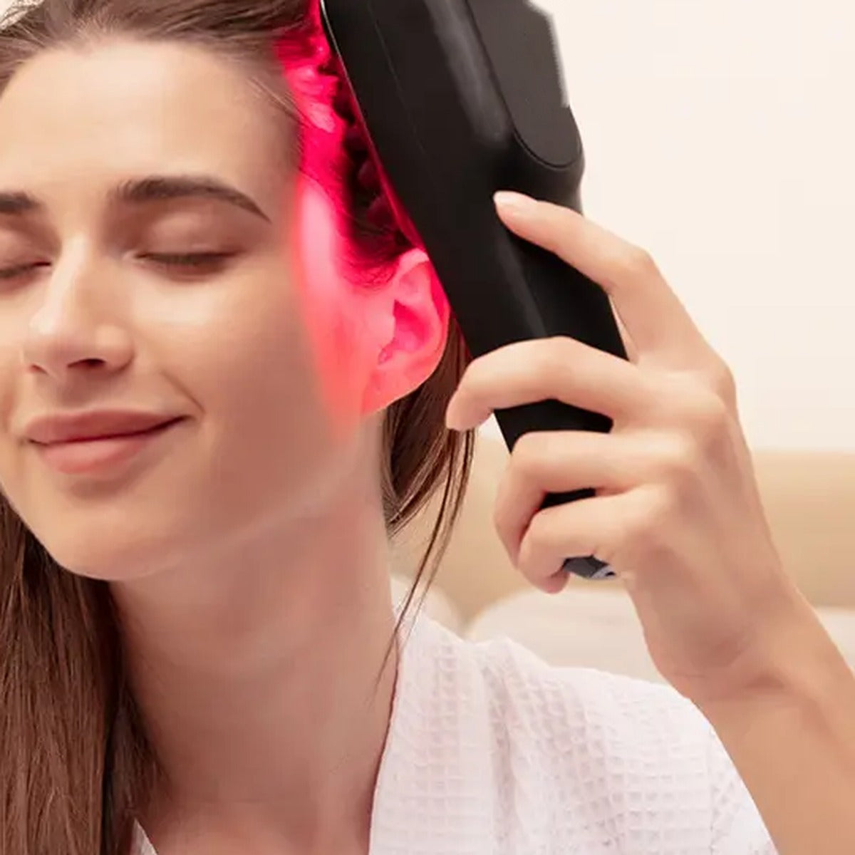 Woman relaxing with the PIRRA scalp massager
