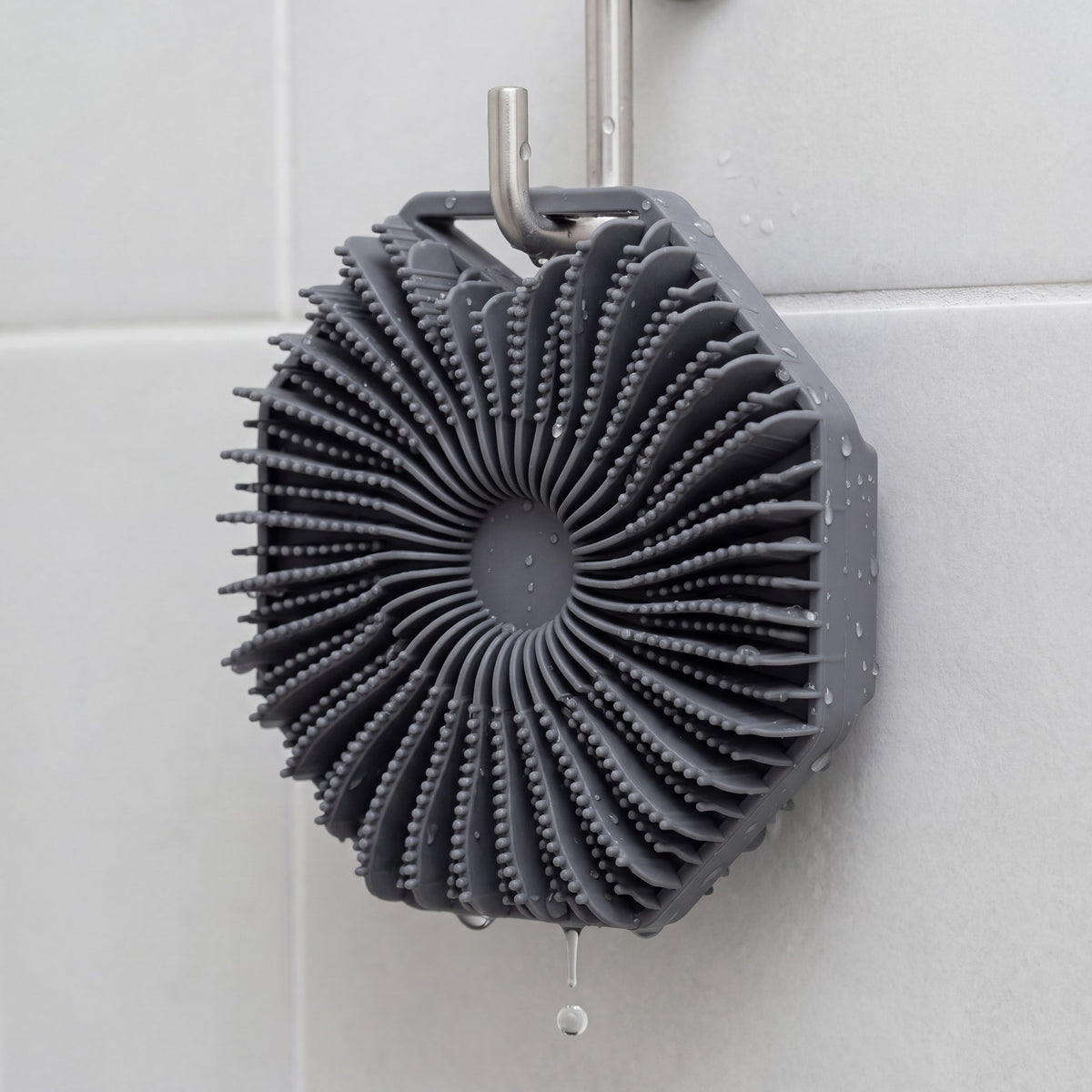 SKURA drying on a shower hook by its hang loop