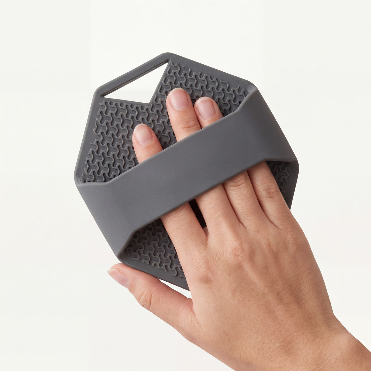 A hand slid under the wide strap on the back of SKURA