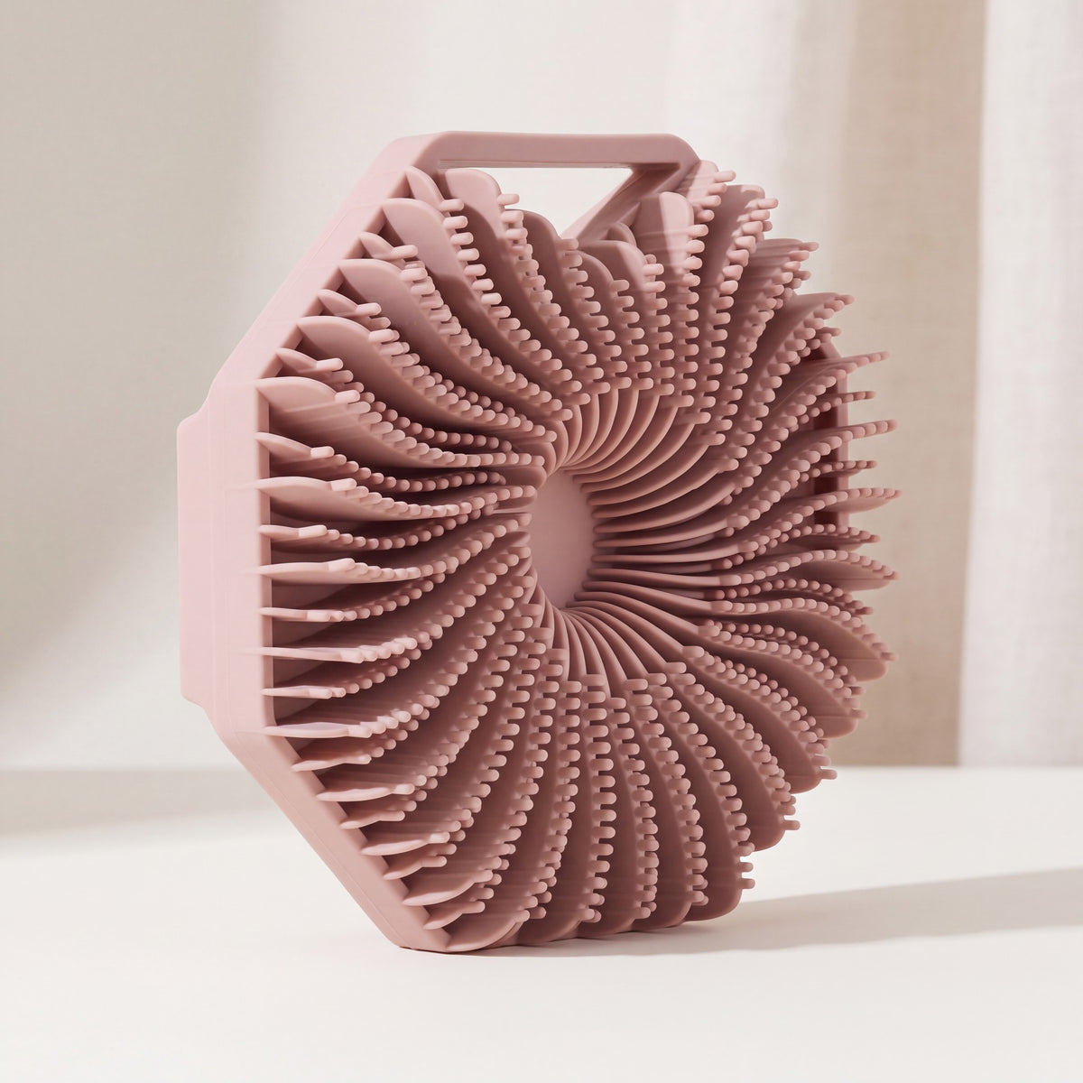 SKURA silicone body scrubber in blush