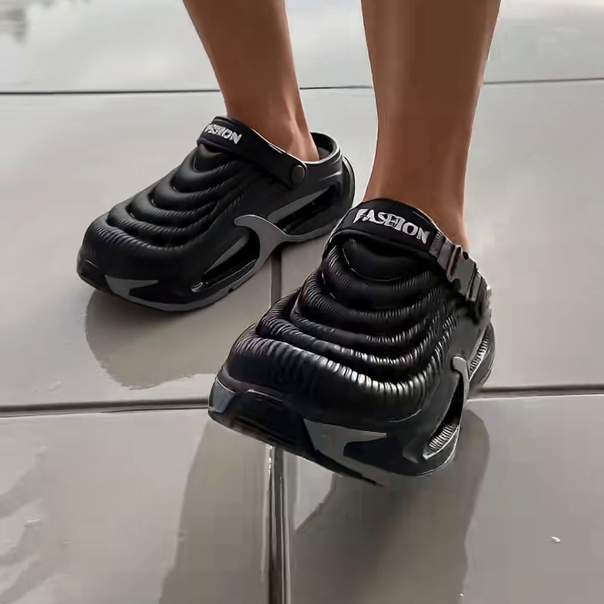 SVALA clogs in Black by the pool