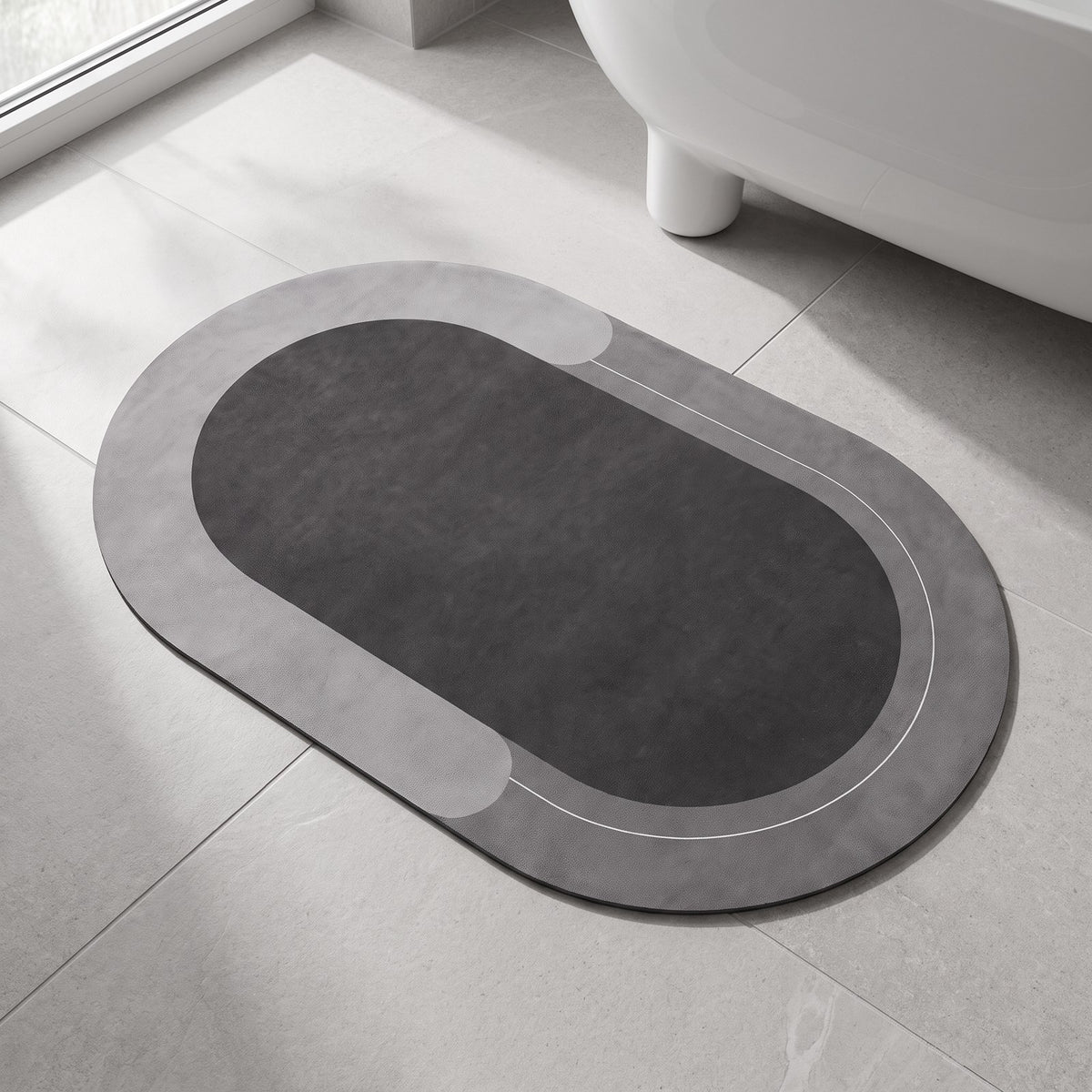 The Quick-Dry Mat in charcoal on a stone bathroom floor