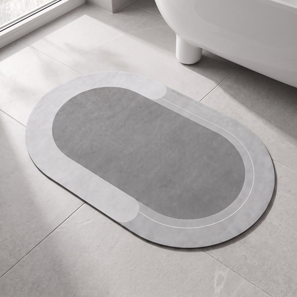 The Quick-Dry Mat in light gray on a stone bathroom floor