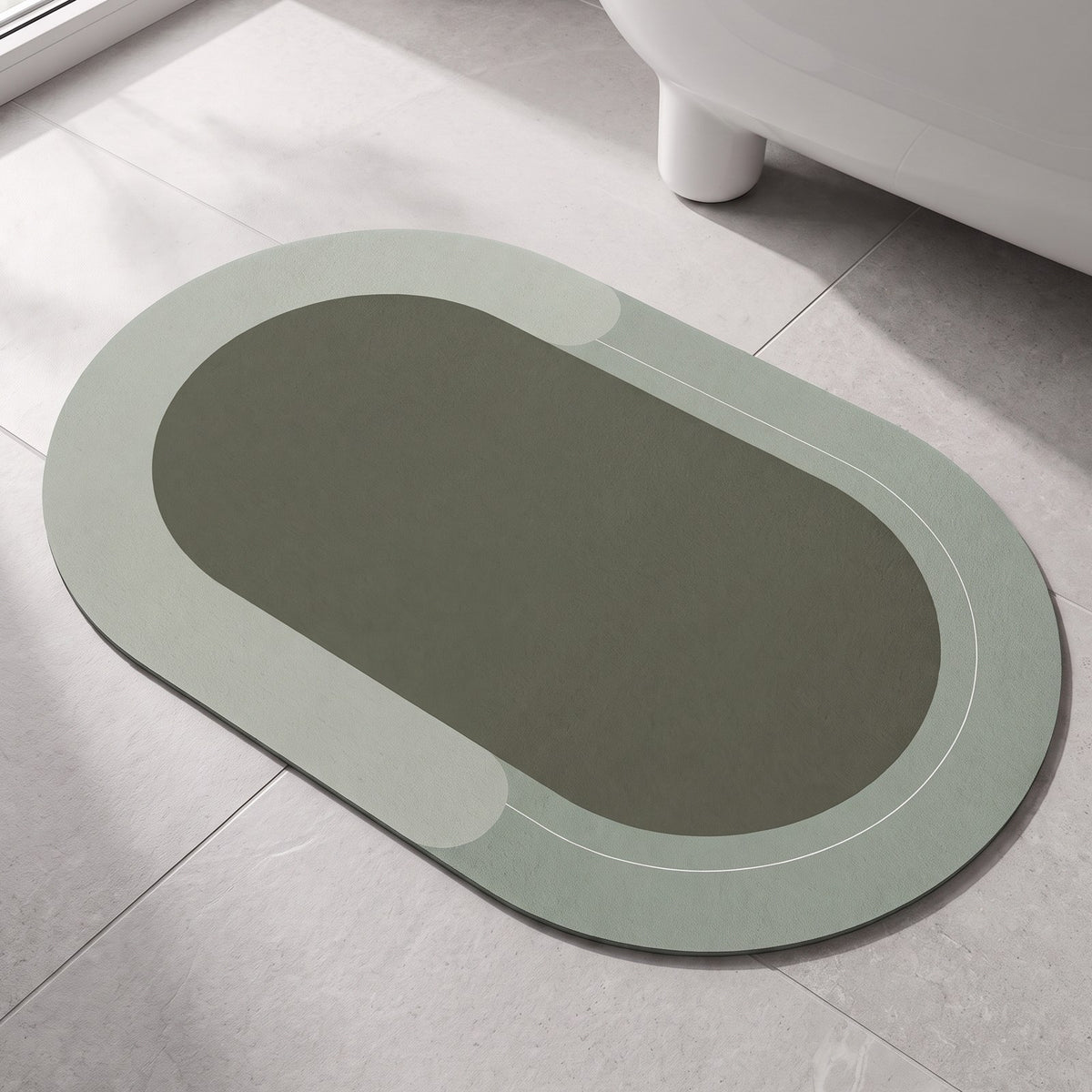 The Quick-Dry Mat in forest green on a stone bathroom floor