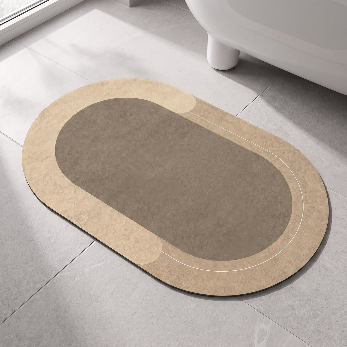 The Quick-Dry Mat in tan on a stone bathroom floor