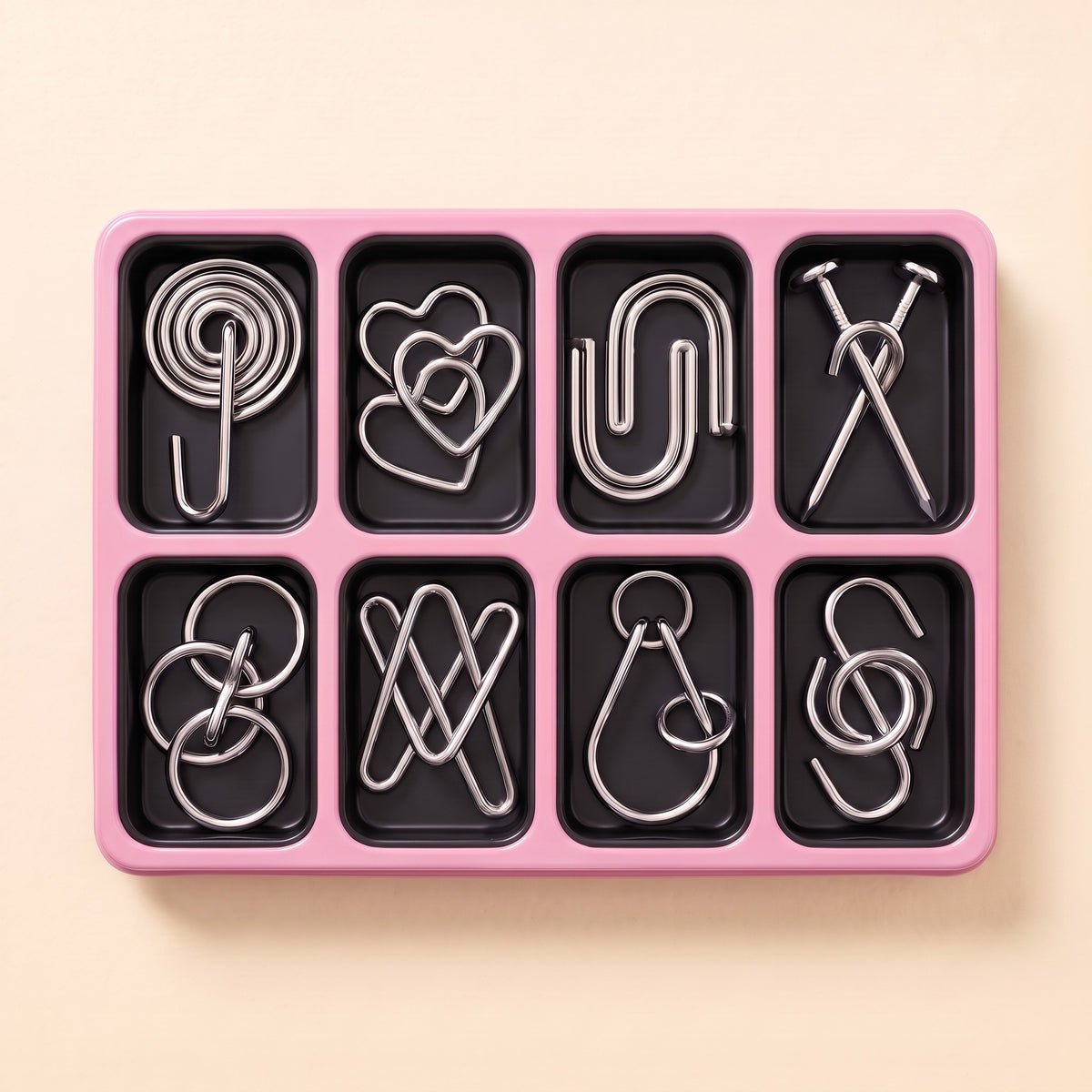 Pink tray with 8 metal wire puzzles